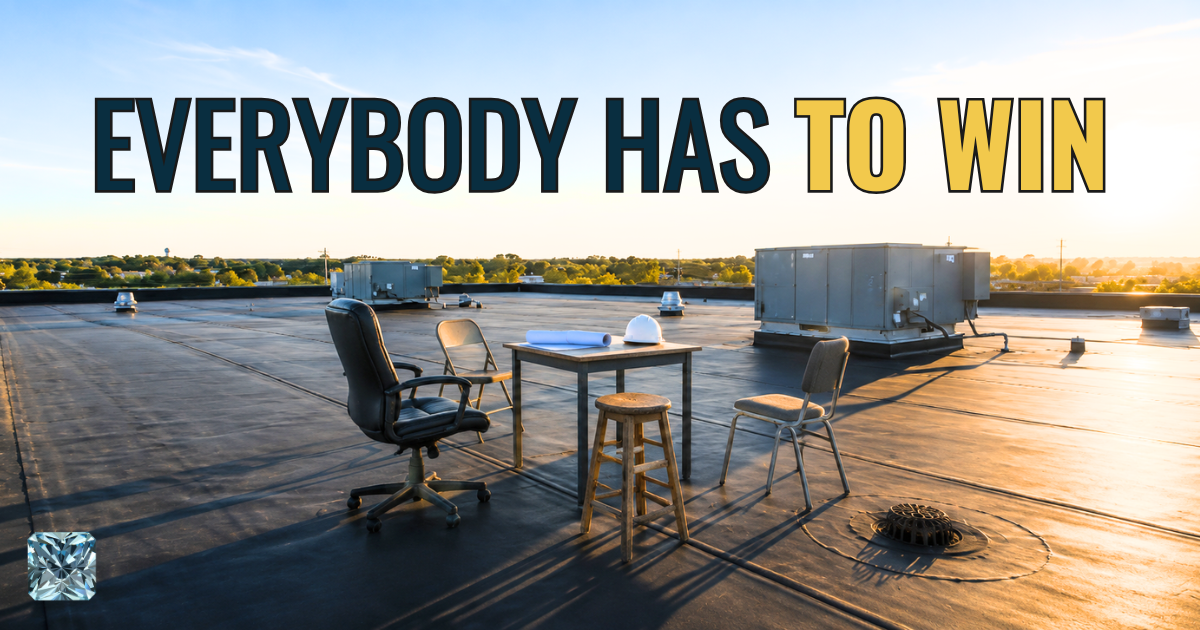 Everybody has to win. Title card over a commercial flat roof with a table and chairs set up for a meeting