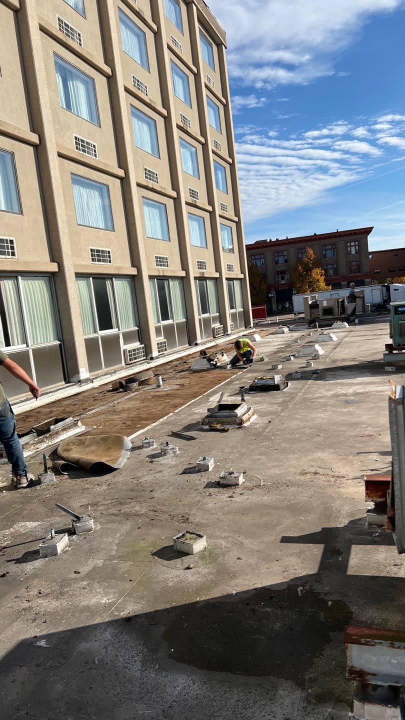 Construction work installation in progress on multi-story building