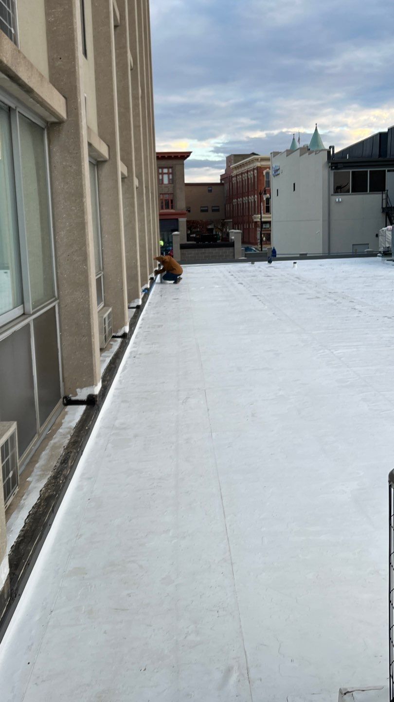 Pristine Industrial Roofing in action on working on a commercial flat roof.